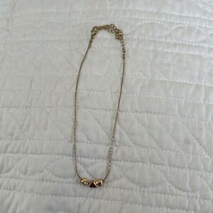 Three hearts golden necklace